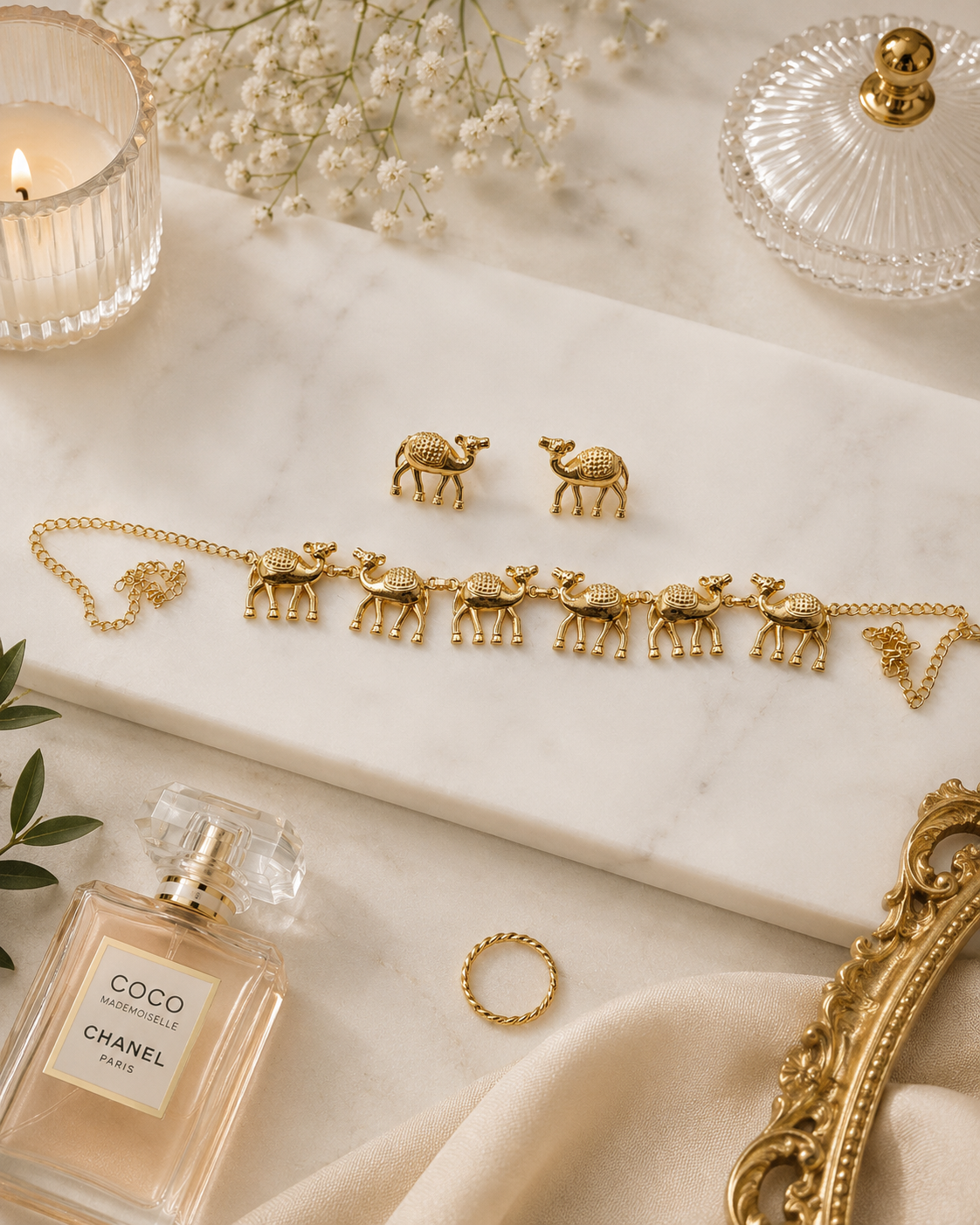 Desert Camel Necklace Set with matching gold camel stud earrings displayed on marble background.
