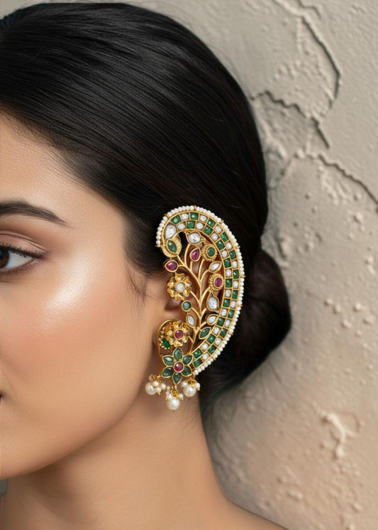 Close-up of Emerald Bloom Ear Cuff Set with emerald green zircon stones and antique gold finish.