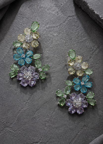 Premium multicolor floral statement ear cuffs with pastel crystals and rhodium finish displayed on grey stone background