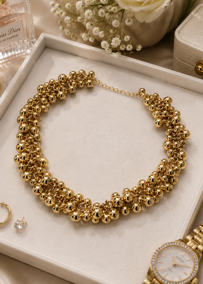 Gold Bead Statement Necklace flat lay showcasing clustered gold-tone bead design and adjustable statement neckpiece