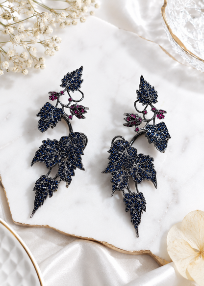 Ivy Bloom Blue Ear Cuffs featuring blue crystal stones and statement ear climber styling