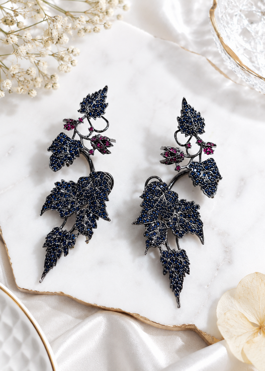 Ivy Bloom Blue Ear Cuffs featuring blue crystal stones and statement ear climber styling