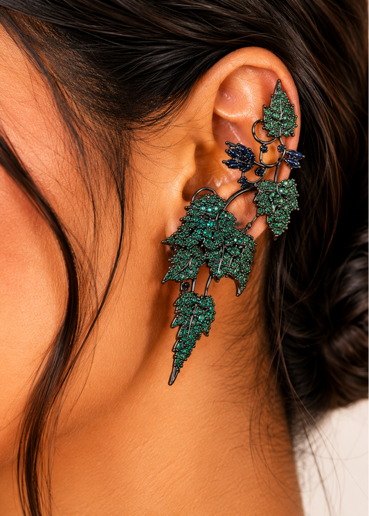 Close-up model wearing Ivy Bloom Green Ear Cuffs featuring elegant green stone detailing and statement styling