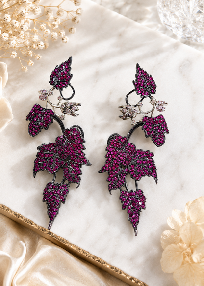 Showcasing Ivy Bloom Pink Ear Cuffs with floral-inspired pink stones and climbing silhouette