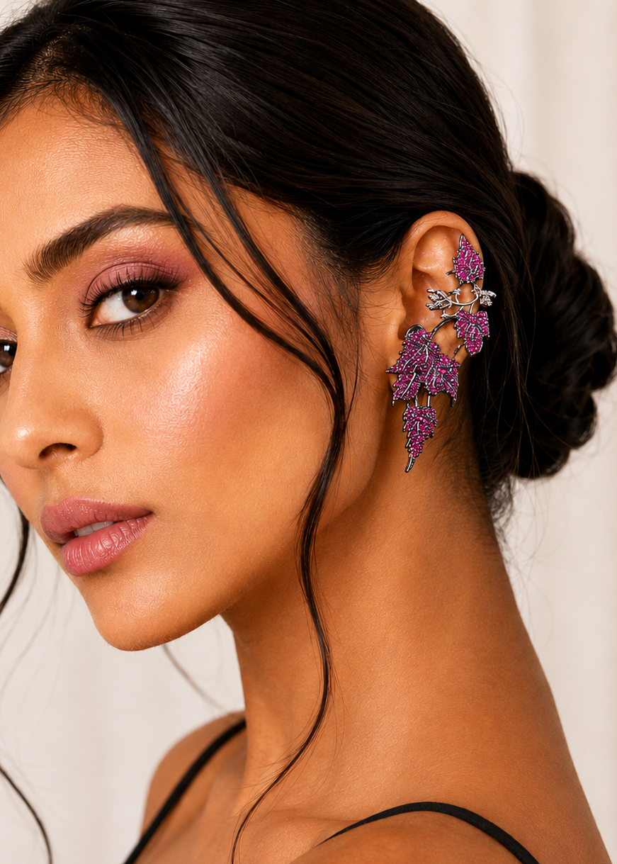 Model wearing Ivy Bloom Pink Ear Cuffs with sparkling pink stones in a floral-inspired ear climber design