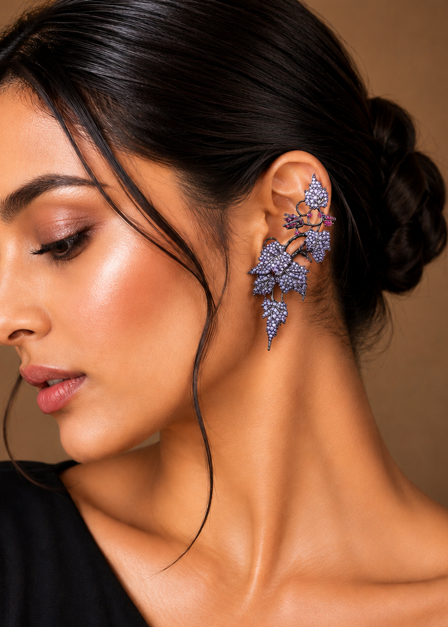 Model wearing Ivy Bloom Purple Ear Cuffs with shimmering purple stones in an elegant ivy leaf ear climber design