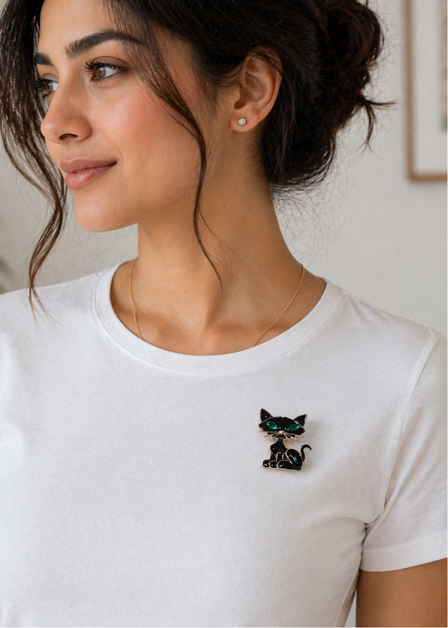 Woman wearing Kitty Charm Black Cat Brooch on a white t-shirt