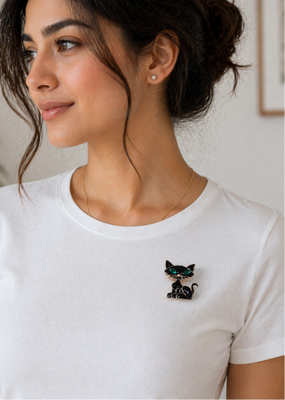 Woman wearing Kitty Charm Black Cat Brooch on a white t-shirt