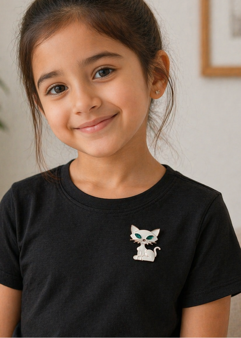 Kitty Charm White Cat Brooch styled on a black t-shirt