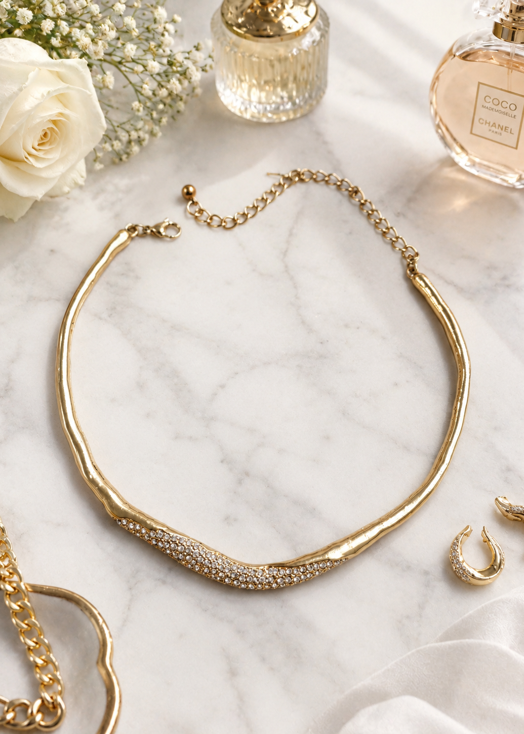 Luna Gold Crystal Hasli Necklace flat lay showcasing crystal detailing and adjustable gold-tone statement necklace design