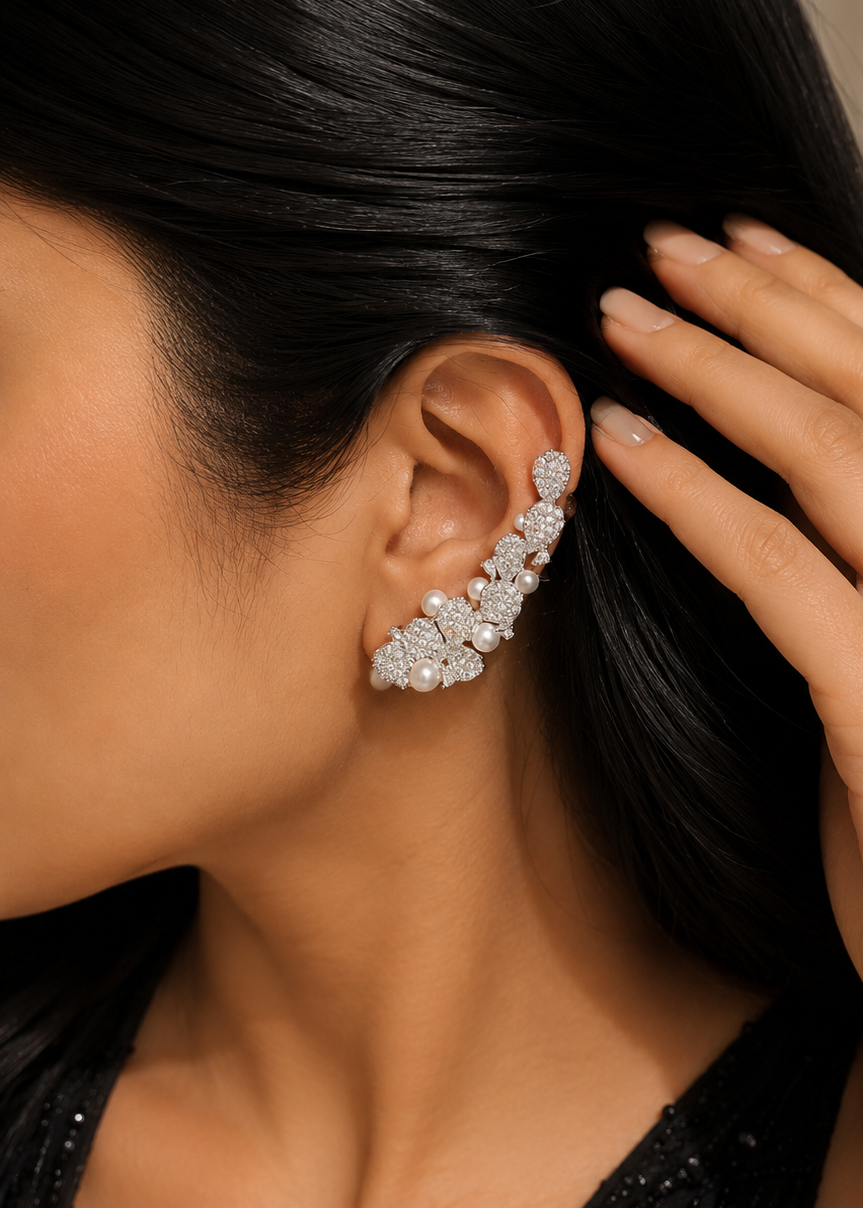 Model wearing Lunaria Pearl Ear Cuff Set with shimmering cubic zirconia crystals and pearl accents in an elegant ear climber design.