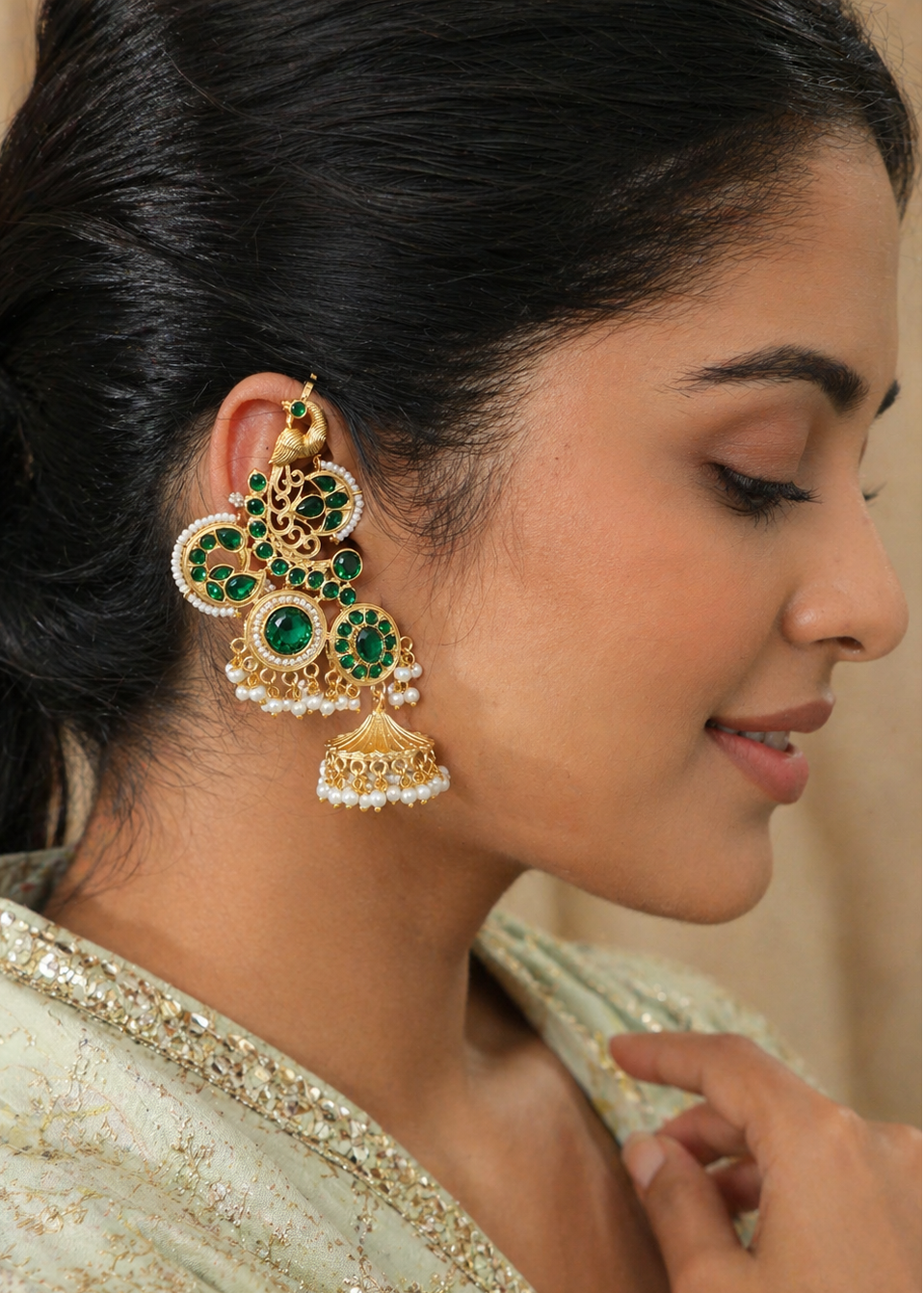 Rajsi Emerald Ear Cuff worn by a model featuring pearl jhumka drops and floral zircon detailing.