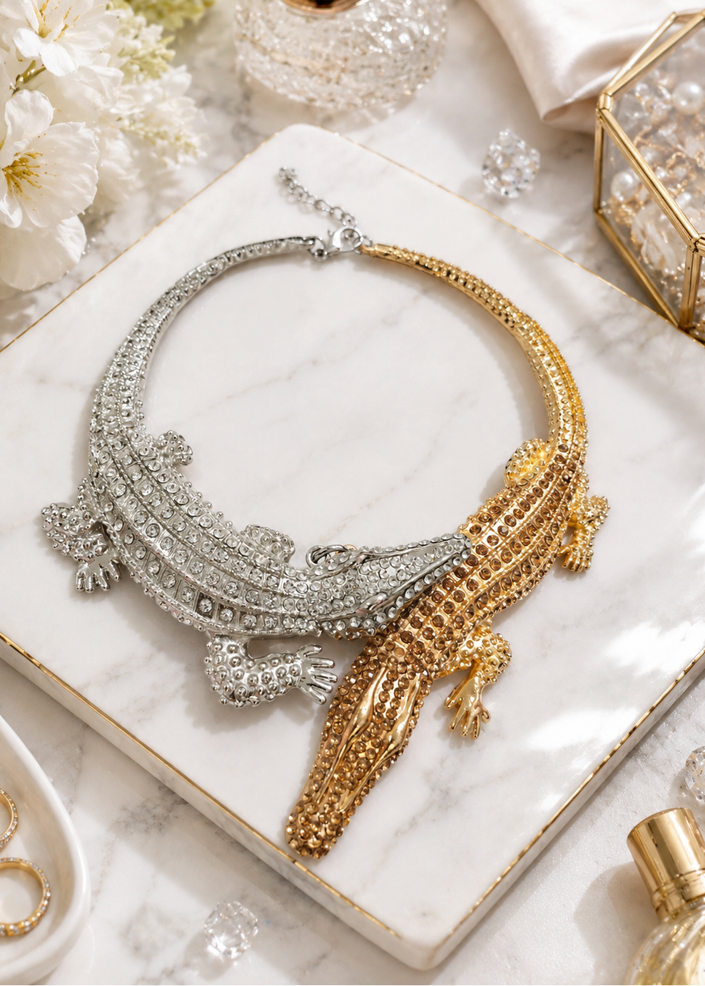 Flat lay of Regal Crocodile Statement Necklace showcasing dual-tone gold and silver crystal crocodile design.