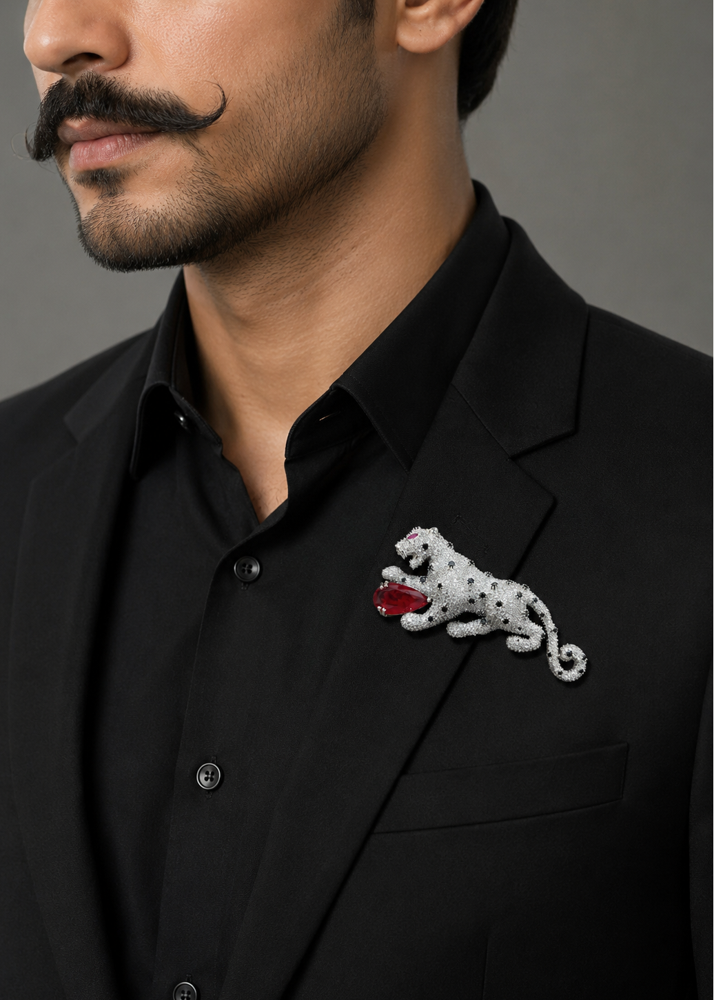 Model wearing Regal Red Panther Brooch on a black outfit showcasing the luxury panther design