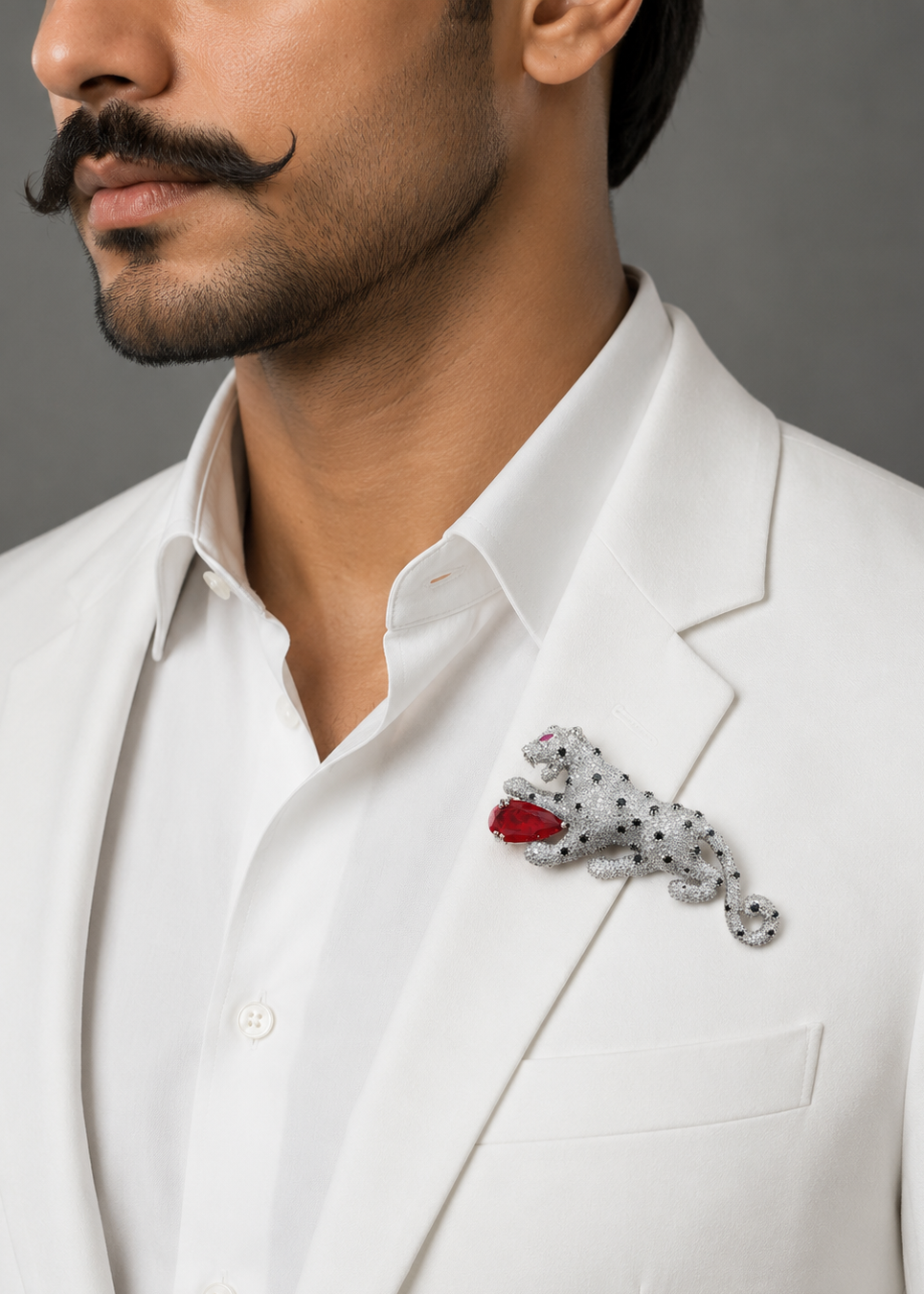 Model wearing Regal Red Panther Brooch on a white outfit for elegant statement styling