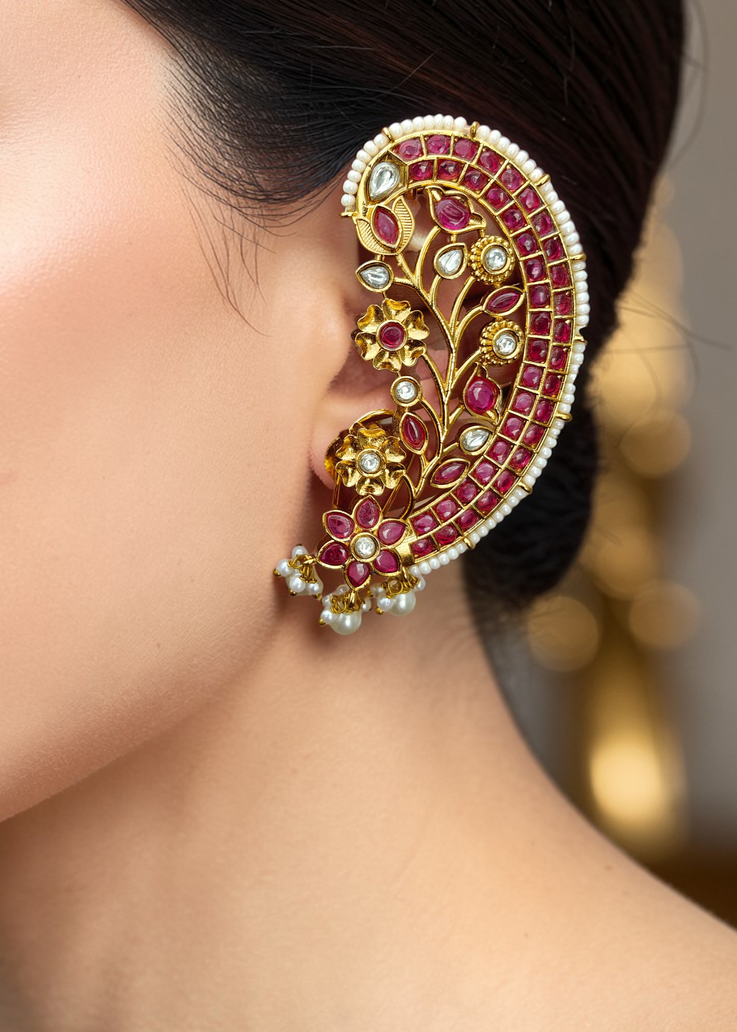 Ruby Bloom Ear Cuff Set worn by a model featuring ruby-toned zircon stones and floral detailing.