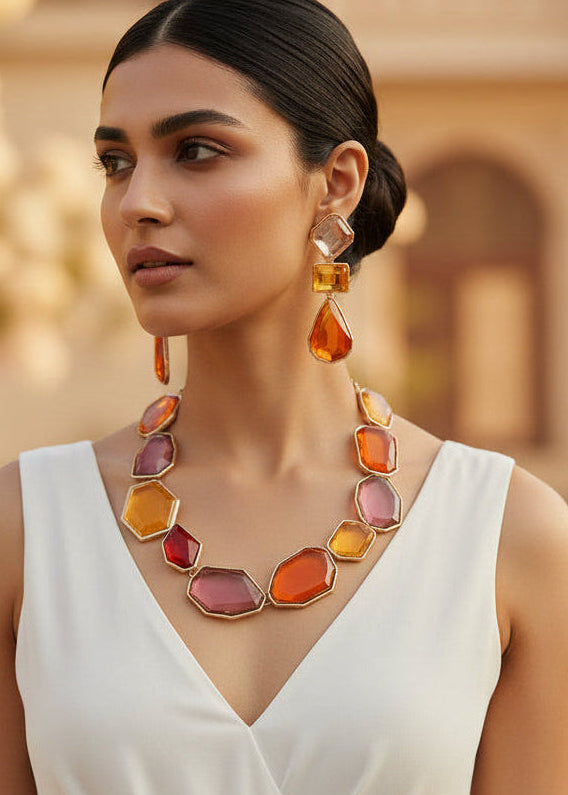 Model wearing Sunset Multicolor Statement Necklace Set with matching drop earrings