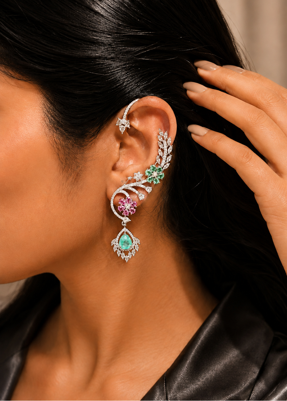 Model wearing Verdelle CZ Floral Ear Cuff Set featuring emerald green floral stones, pink accents and sparkling cubic zirconia.